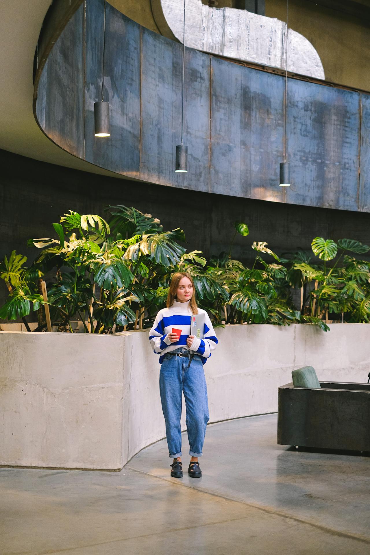 lady standing with plants in the background - Plant Studio